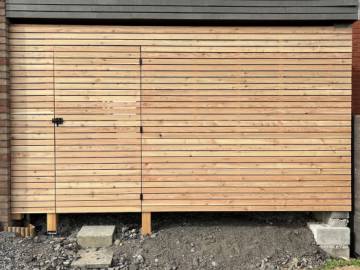 Réalisation d'un abri à vélo dans le prolongement d'un carport