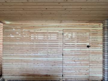Réalisation d'un abri à vélo dans le prolongement d'un carport